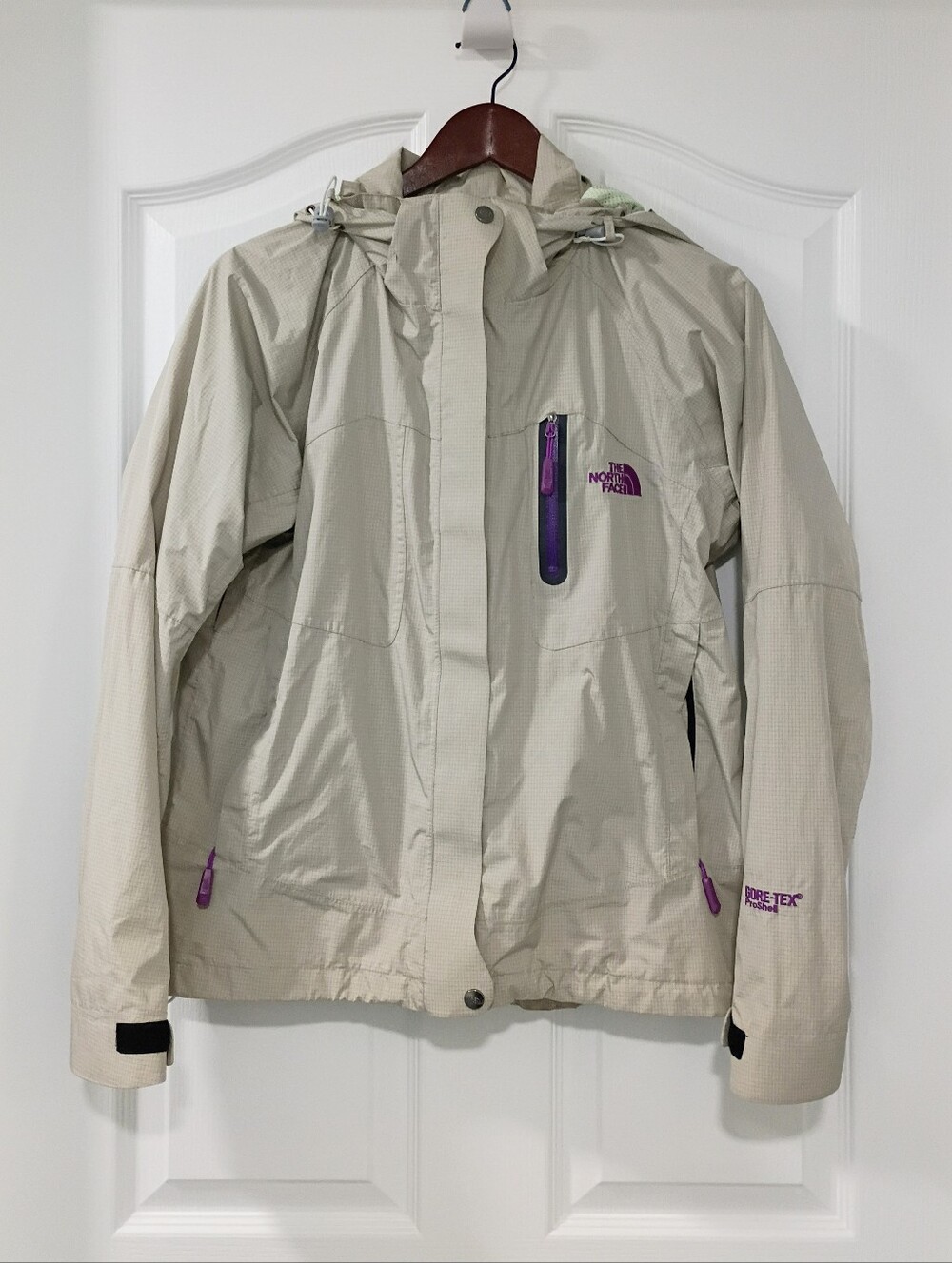 The North Face Women's Light Beige Rain Jacket with Purple Accents